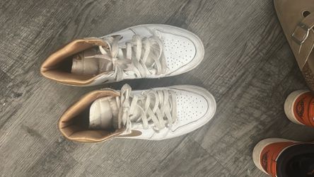 Gold and white Nikes