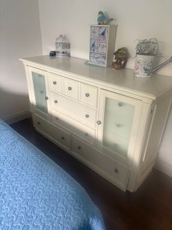 White Wood Dresser with Glass Panel Doors