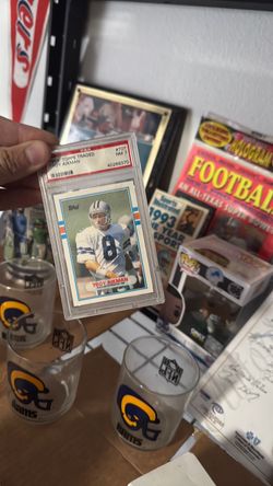 Troy Aikman lot - PSA 7 rookie card, 1993 sealed NFL Magazine & SI VHS
