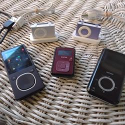 IPOD SHUFFLES (2) SILVER & PURPLE, MICROSOFT ZUNE 8GB, SANSA 4GB & SANSA MAROON MICRO (LOT OF FIVE DATA PLAYERS) $80 FOR ALL OF THEM
