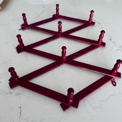 Vintage wood accordion 10 peg hat/coat rack has been painted in cranberry red.