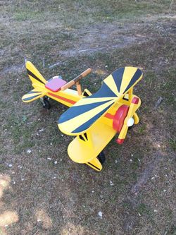 Kids solid wooden air plane on wheels works great