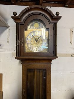 Howard Miller grandfather clock with moon phase dial