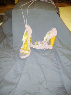 Size 8. 4" open heal. Tie-up strip purple dress shoe.