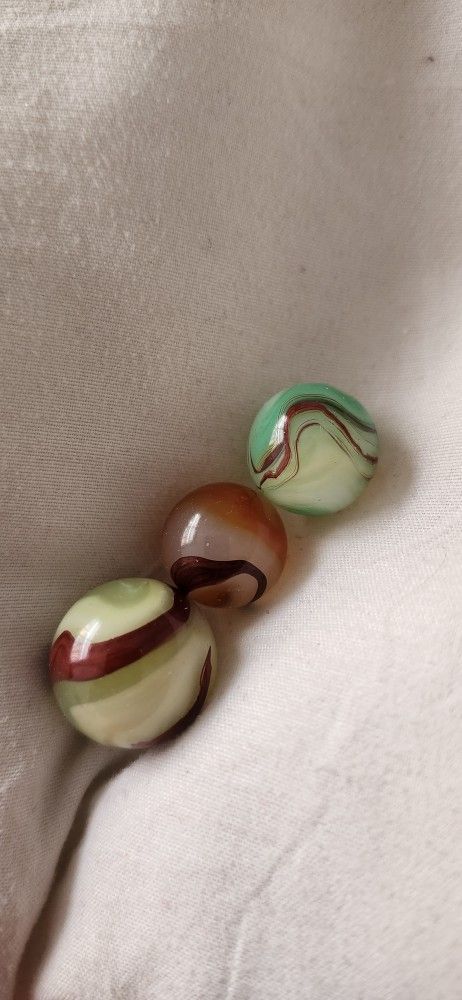 Three Beautiful Oxblood Marbles