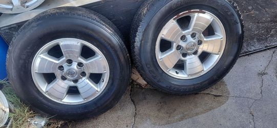 5 Stock Toyota Tacoma rims with tires