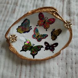 Butterfly decorated clam shell with gold accents
