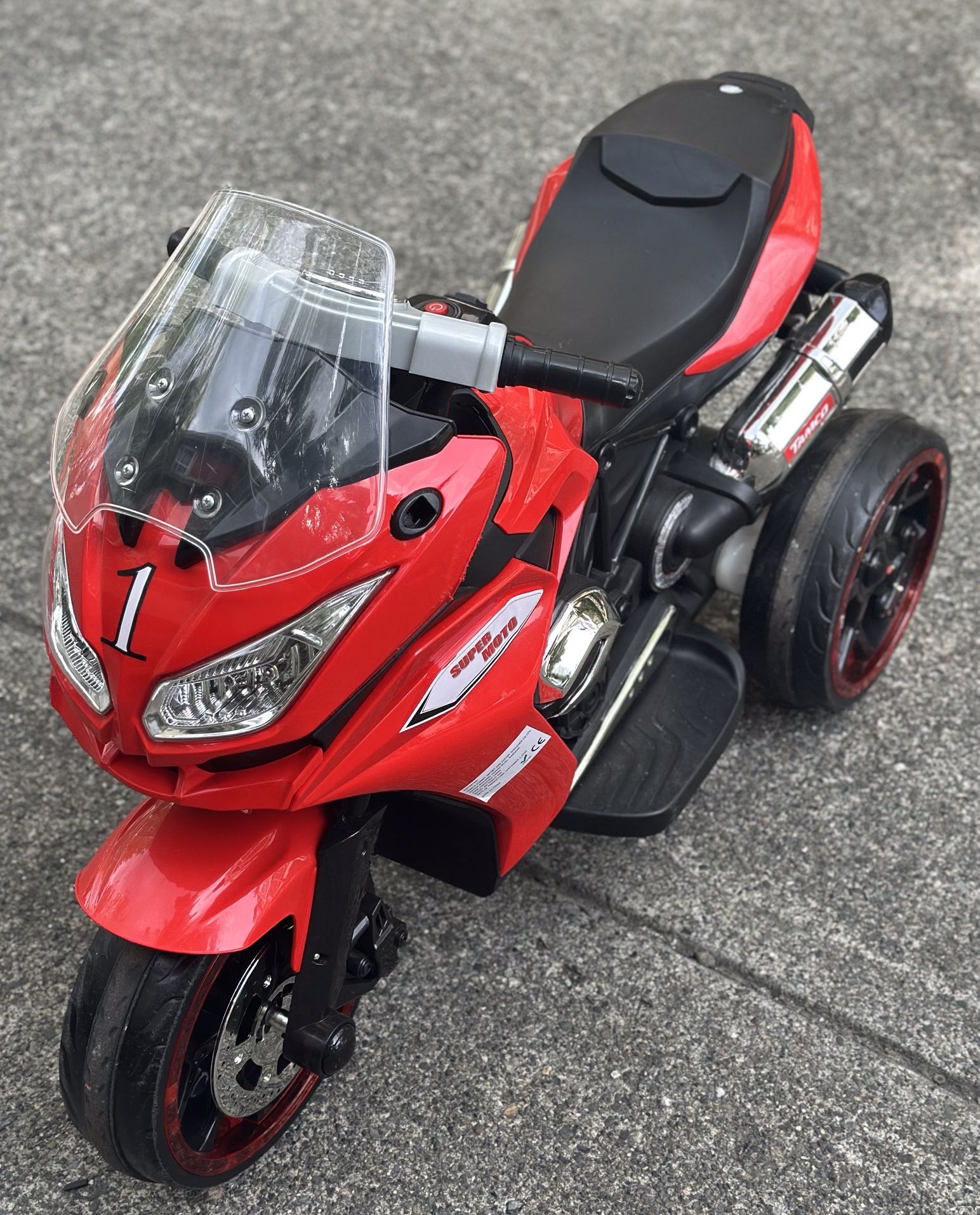 Kids Electric Motorcycle, Ages 3 -6, Music, Sounds, Twinkling Wheels By TAMCO Electric Ride on Toy,12 V Kids Motorcycle (RED)