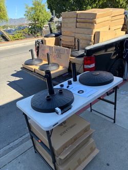 New Umbrella Bases 28lb holders in box