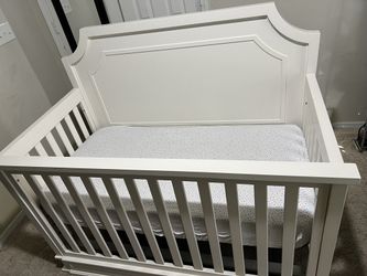 white crib and changing table, with mattress included