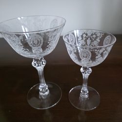 Collection of 8 sets of Tiffin-Franciscan etched crystal coupe glasses in the 'June Night' pattern.