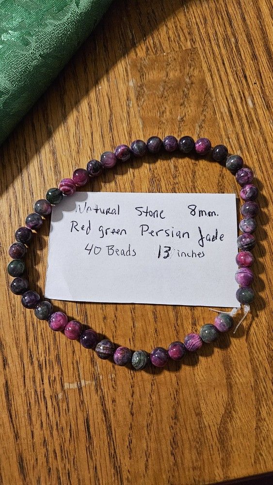 Natural Stone Red Green Persian Jade
This is a strand of 40 beads (8MM) 13 inches long. Use as needed for Necklace, Bracelet, Rings, and/or Earrings.