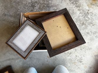 Box of assorted new and older picture frames
