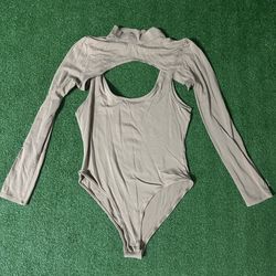 Heart and Hips Tan long sleeve bodysuit with cutout size L