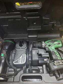 Hitachi 12 volt drill & light combo with case. Needs new batteries.