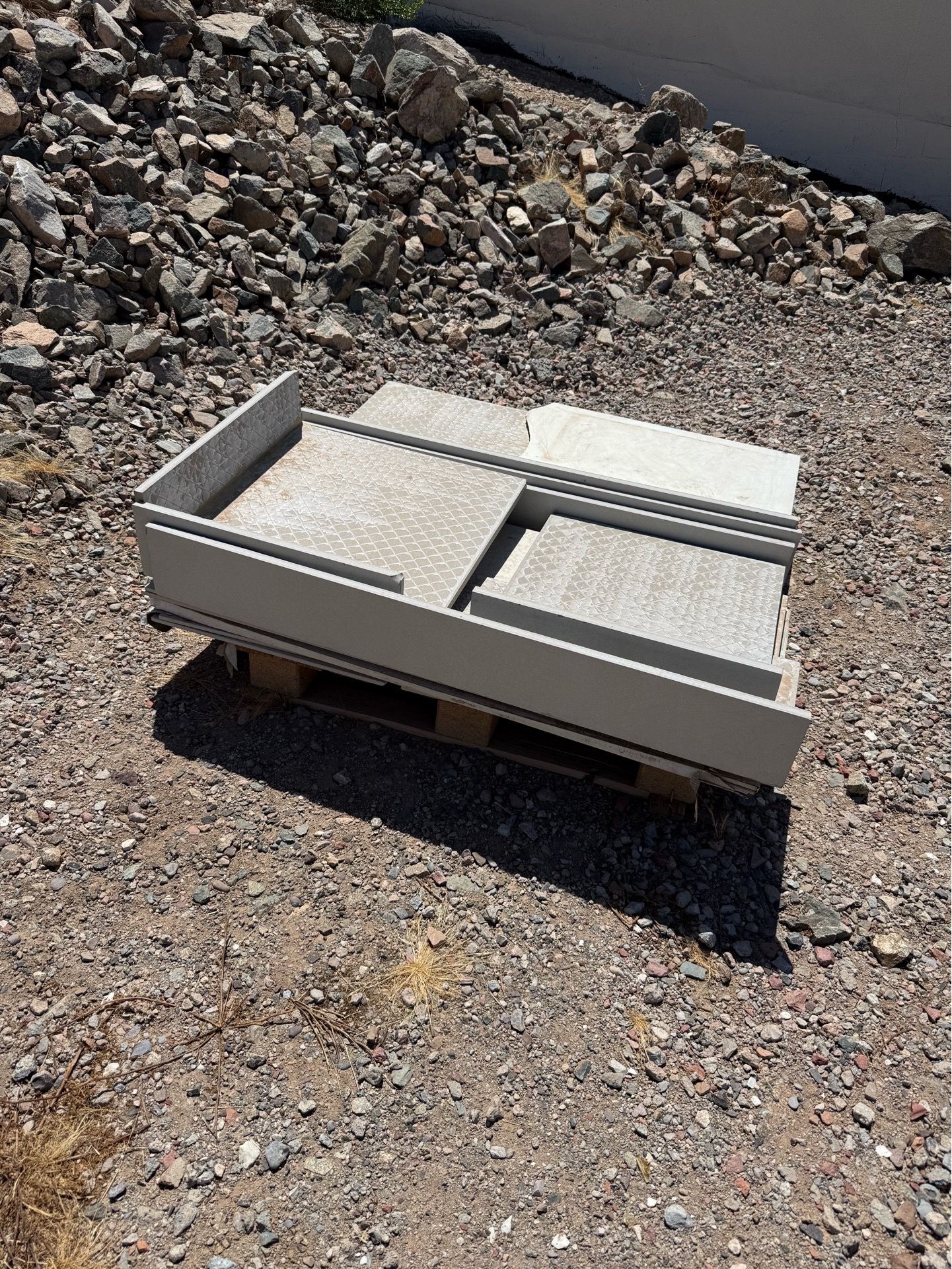 Concrete pavers and porcelain tiles