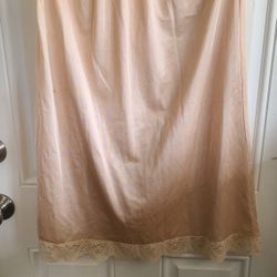 Older, yet new Merville beige nylon half slip large 30-32 non cling. East, north, west