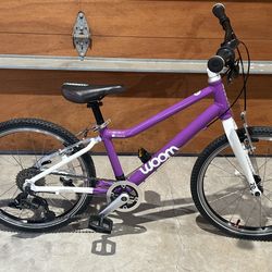 Woom 4  20 inch 8 speed light weight kids bike