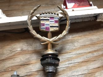 Gold Cadillac hood ornament & emblem