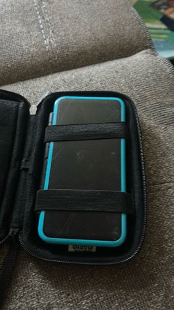 Nintendo 3ds light blue and includes stick for touch pad