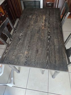 mesa de madera color gris oscuro 4 sillas