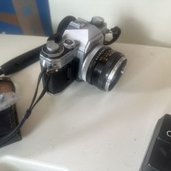 Canon AT-1 Camera With Lenses And Flash 