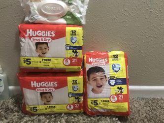 3 packs of diapers snug and dry size 6 with 2 packs of wipes