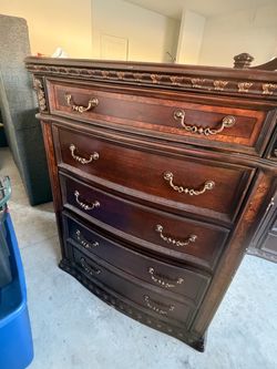 Dark Wood Chest of Drawers with Ornate Detail