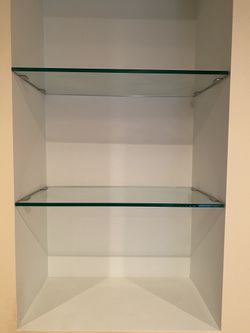 Two glass shelves with stainless steel hinges