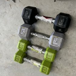 pair of 8 and 15lb rubber dumbbells. SOLD AS IS $40