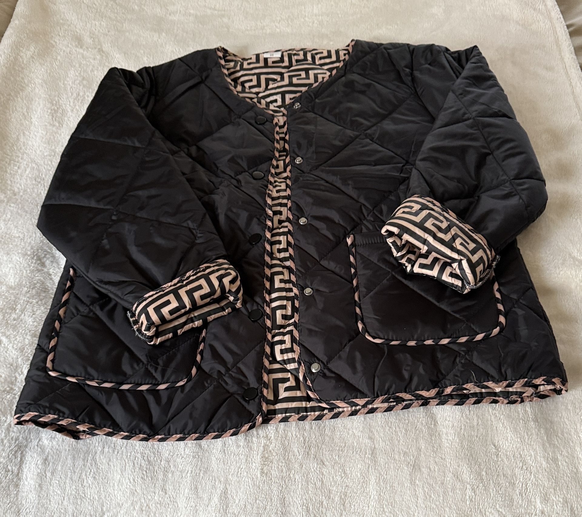 Elegant Black Quilted Jacket with Geometric Trim