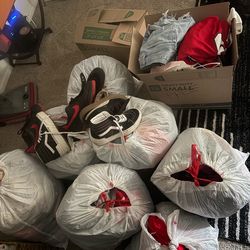 8 trash bags and 2 boxes of clothes and shoes