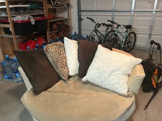 Large Swivel chair with pillows