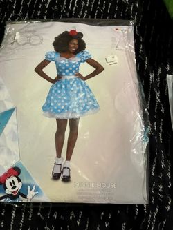 Minnie mouse Halloween outfit size small adult, but it could fit a kid maybe 11 to 12 years old new