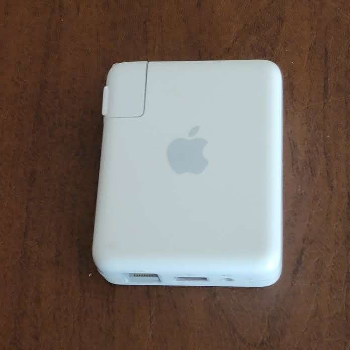 Apple AirPort Express Wireless Router Extender A1264.
Pre-owned, in good working and cosmetic shape