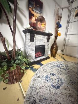 Beautiful Mantel faux stone electric fireplace /tv stand in excellent condition