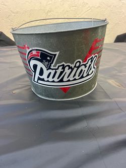 This is a galvanized metal Budweiser and Bud Light ice bucket featuring a wire carrying handle and classic dual-brand graphics patriots