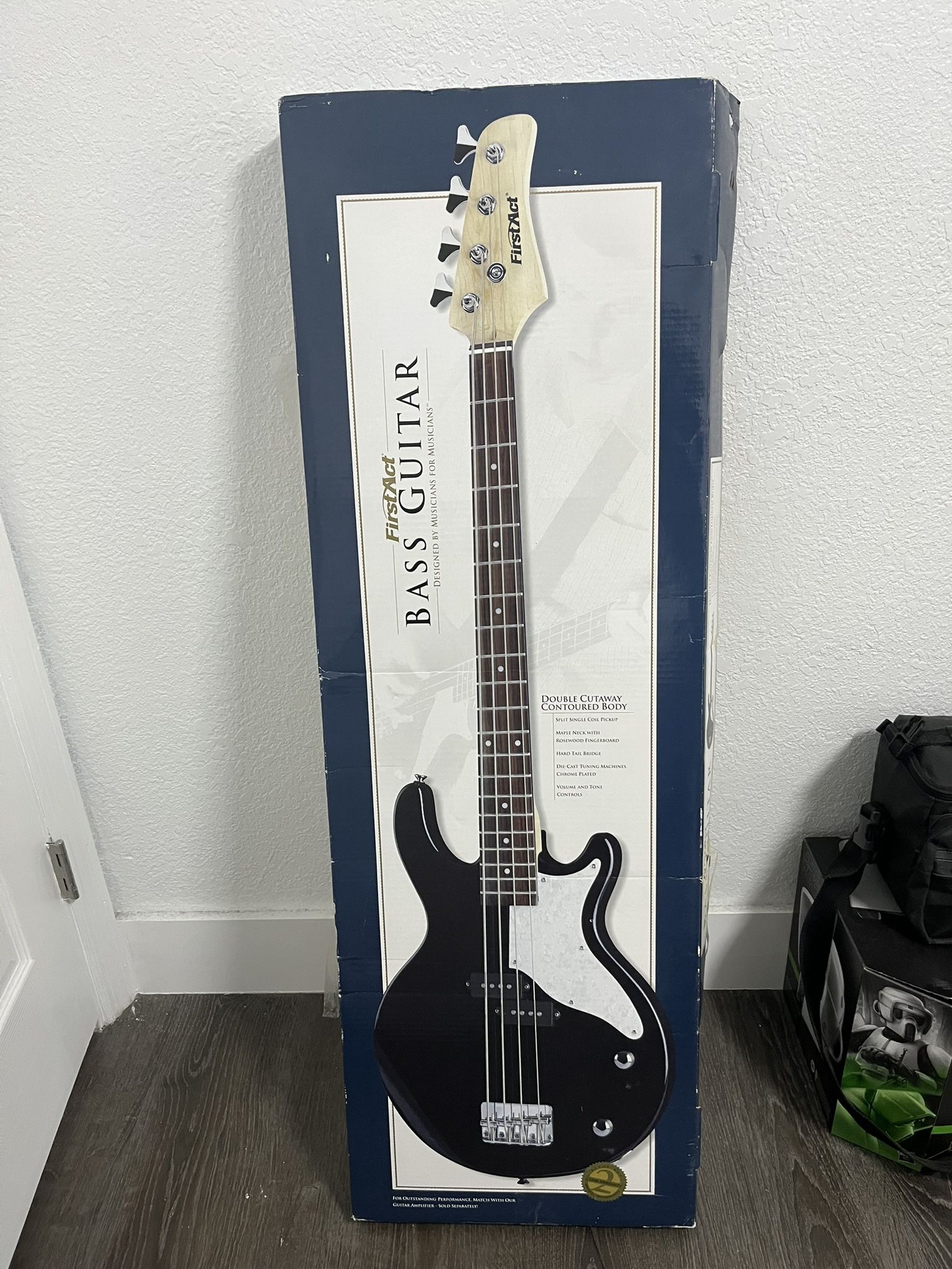 First Act Bass Guitar + Extra Strings And Stand