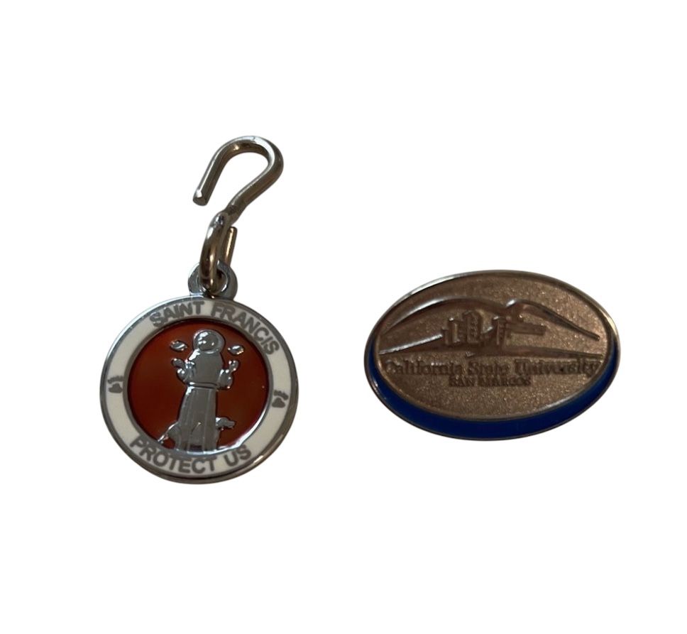 2 Pins - California State University, San Marcos, and the other pin for Saint Francis protect us