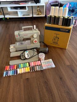 Brand new 1034 Singer serger (still in box) + 4452 singer sewing machine