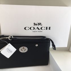 COACH WRISTLET BLACK LEATHER *NEW WITH TAGS & COACH GIFT BOX MSRP $158 Asking $55 Length 7.5", Height 4.5". A thoughtful gift.