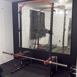 Squat rack, bar, weights, bench