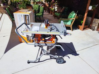 Ridgid 15 Amp 10 in. Portable Corded Pro Jobsite Table Saw with Stand(open box never used)