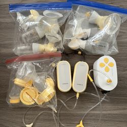1 Medela In Style Pump & 2 Medela Cordless Pumps and Many Parts