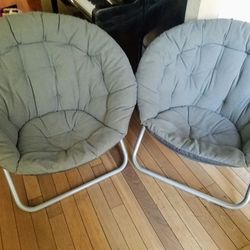 two gray papasan-style low-profile lounge saucer chairs, foldable