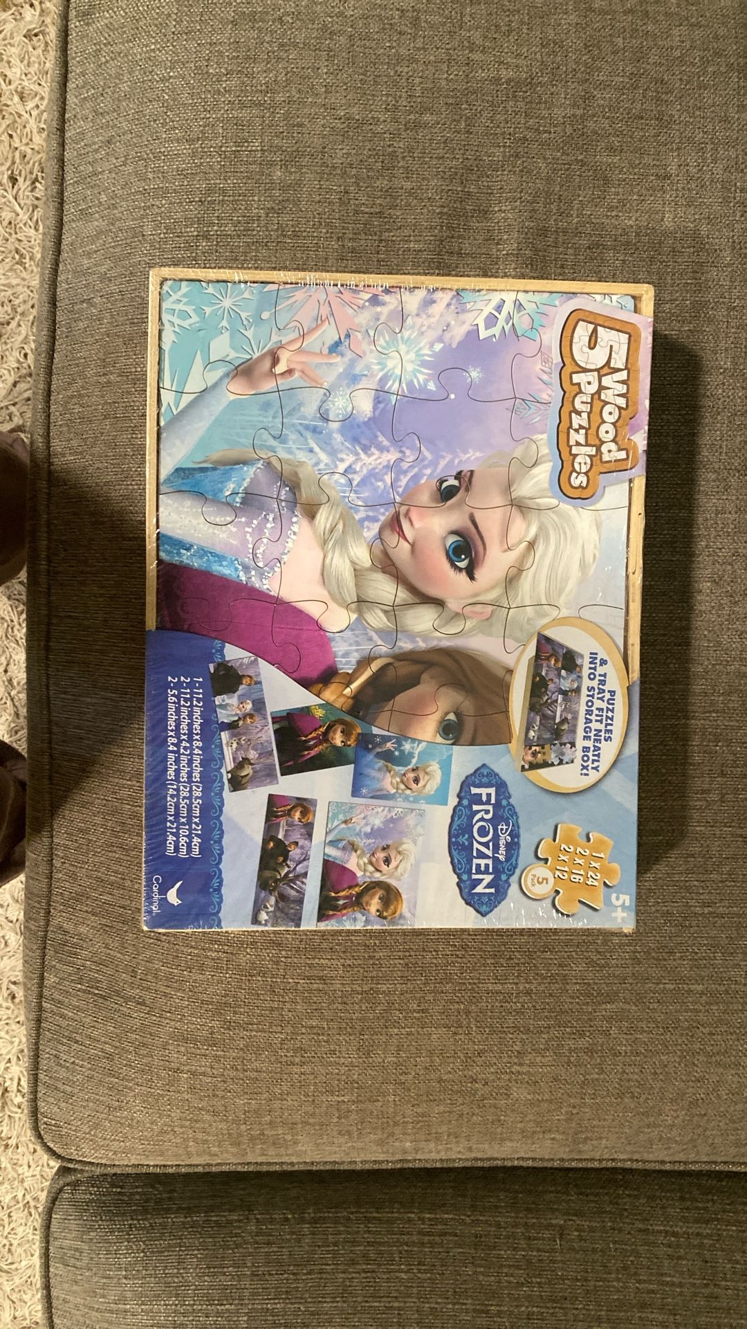 Frozen    Five puzzle set with carrying case.