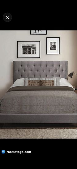 gray upholstered queen bed