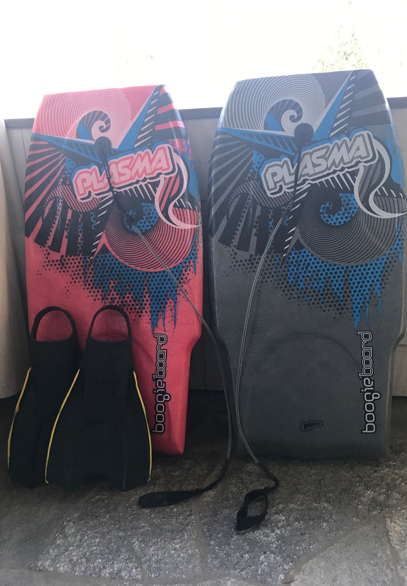 Two plasma boogie boards & 1pair of XL fins