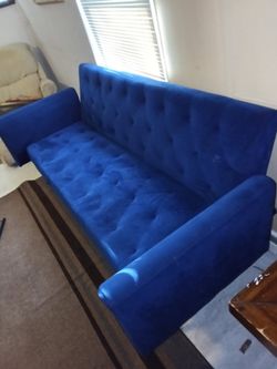Vintage blue velvet futon with brass legs