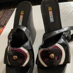 - [ ] Vintage Nascar Wedges. High heels. Leather look. Race track attire. Racing Old shoes.